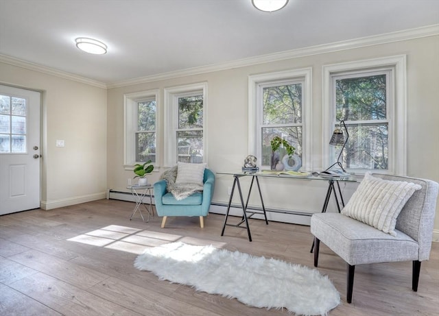 living area featuring baseboard heating, crown molding, and light hardwood / wood-style floors