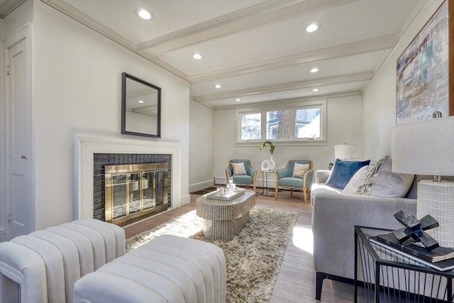 living room with radiator, light hardwood / wood-style flooring, ornamental molding, and beamed ceiling