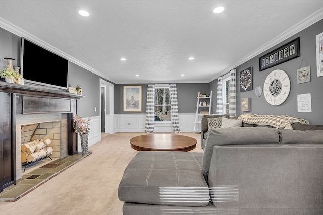 living room with a tile fireplace, crown molding, light carpet, and a textured ceiling