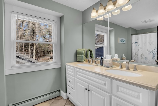 bathroom featuring a shower with curtain, vanity, tile patterned floors, and a baseboard heating unit