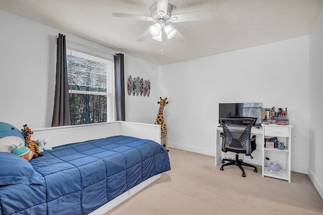 bedroom featuring light carpet and ceiling fan