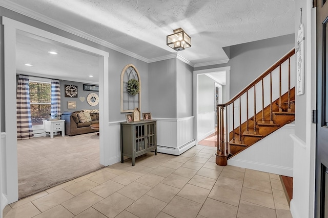 entrance foyer with light carpet, crown molding, and a textured ceiling