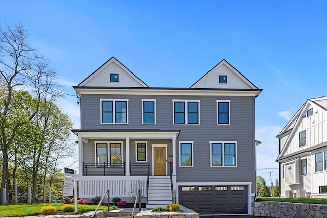 view of front of home featuring a porch, an attached garage, stairway, and board and batten siding