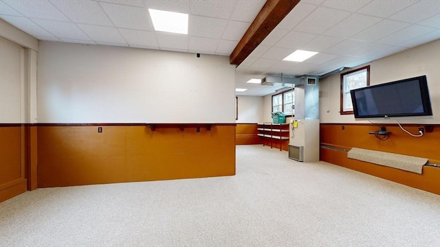 interior space featuring light carpet and a drop ceiling