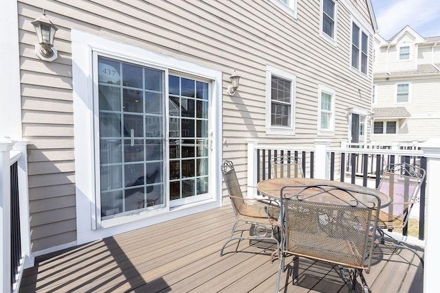 wooden deck with outdoor dining area
