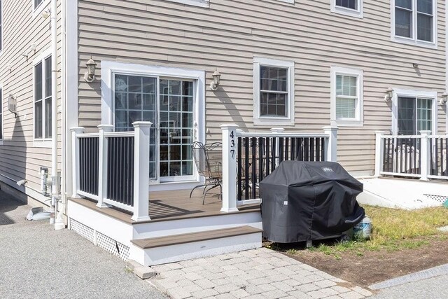 wooden terrace featuring grilling area