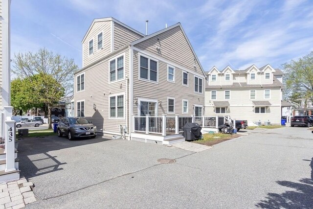view of property exterior with a residential view