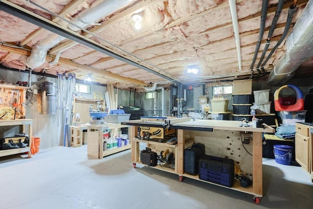 below grade area with a workshop area and healthy amount of natural light