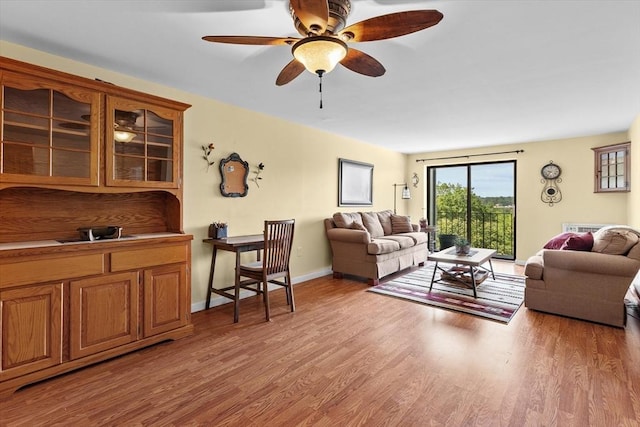 1321 Worcester Rd Unit 605, Framingham, MA 01701 - living area with light wood-style floors and a ceiling fan
