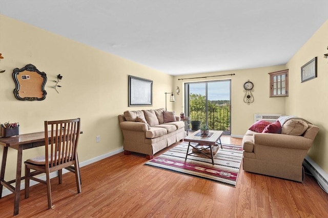 1321 Worcester Rd Unit 605, Framingham, MA 01701 - living area featuring wood finished floors and a baseboard radiator