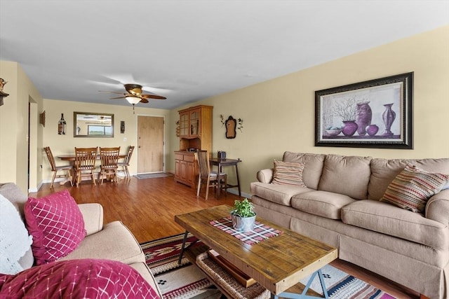 1321 Worcester Rd Unit 605, Framingham, MA 01701 - living area with wood finished floors and a ceiling fan