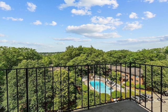 1321 Worcester Rd Unit 605, Framingham, MA 01701 - balcony with view of pool area and a forest view