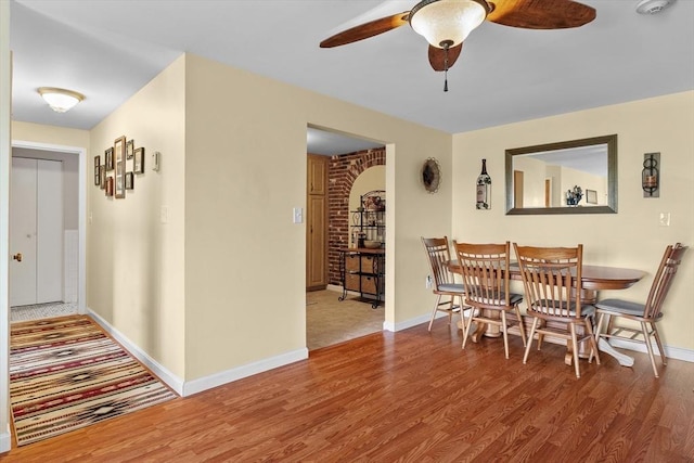 1321 Worcester Rd Unit 605, Framingham, MA 01701 - dining space featuring wood finished floors, ceiling fan, and arched walkways
