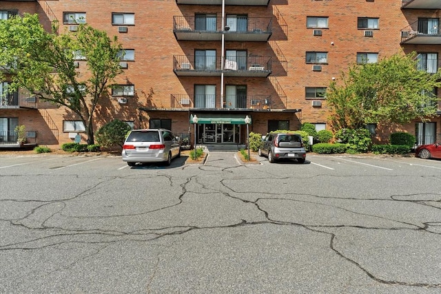 1321 Worcester Rd Unit 605, Framingham, MA 01701 - view of apartment building / complex featuring uncovered parking