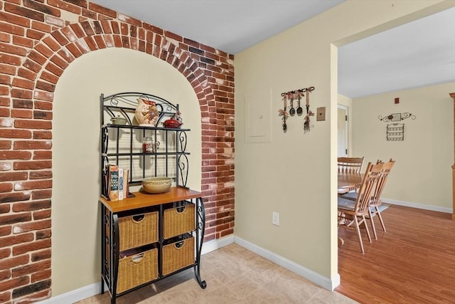 1321 Worcester Rd Unit 605, Framingham, MA 01701 - hallway featuring brick wall