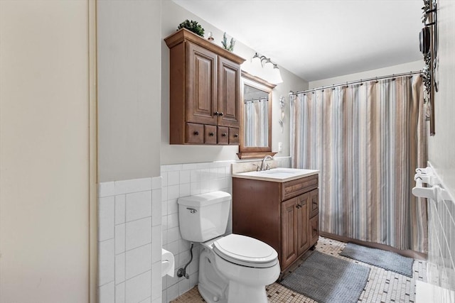 1321 Worcester Rd Unit 605, Framingham, MA 01701 - full bath with vanity, tile walls, tile patterned floors, wainscoting, and a shower with curtain