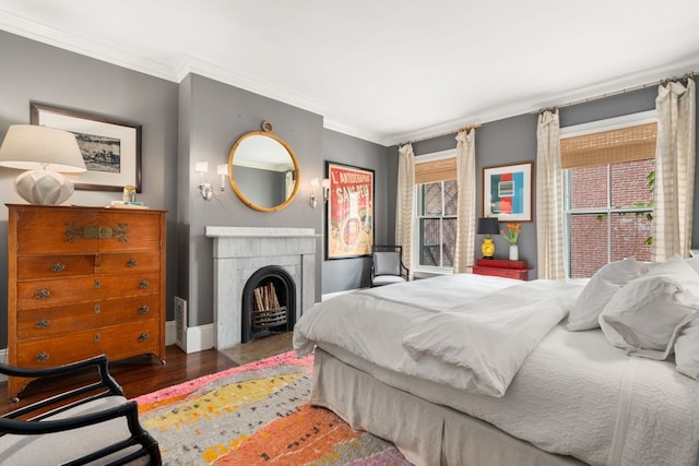 bedroom featuring crown molding and dark hardwood / wood-style floors