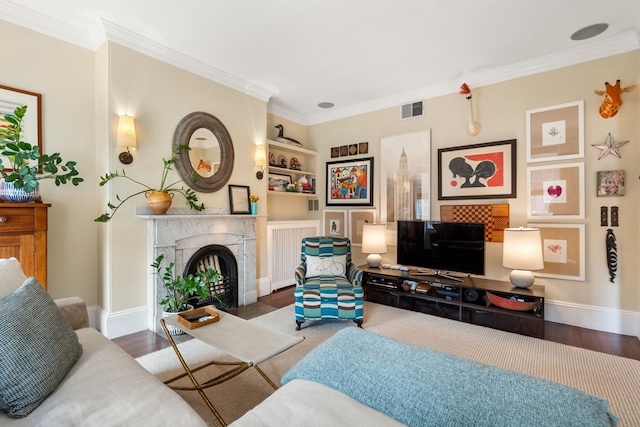 living room with ornamental molding and dark hardwood / wood-style flooring