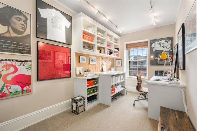 home office with track lighting and light carpet