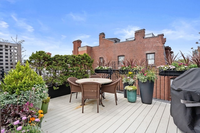 wooden terrace with area for grilling