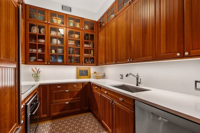 kitchen with sink and appliances with stainless steel finishes