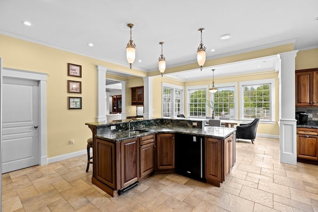 33 Moniz Dr, Westport, MA 02790 - kitchen featuring stone tile floors, a breakfast bar, baseboards, crown molding, and recessed lighting