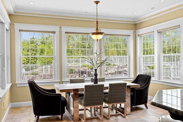 33 Moniz Dr, Westport, MA 02790 - dining space featuring stone tile floors, baseboards, and crown molding