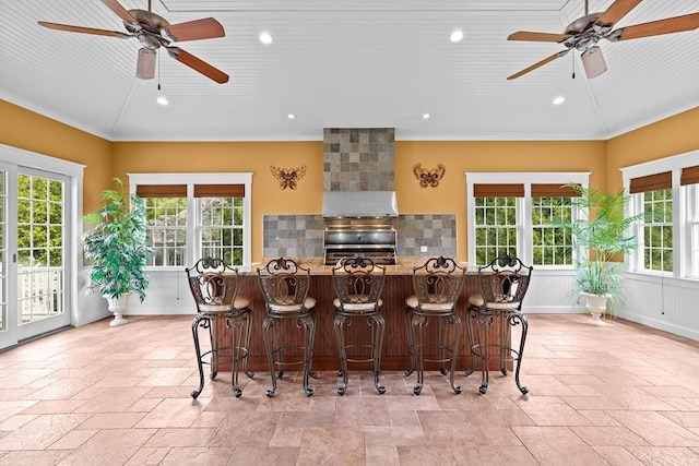 33 Moniz Dr, Westport, MA 02790 - kitchen with a ceiling fan, stone tile flooring, stove, recessed lighting, and ornamental molding