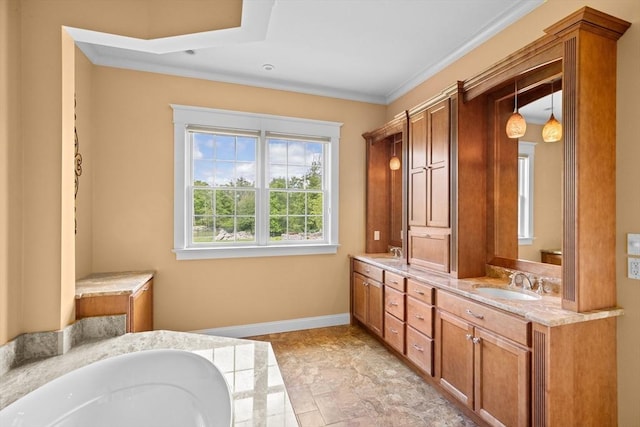 33 Moniz Dr, Westport, MA 02790 - full bathroom with double vanity, a tub to relax in, baseboards, and crown molding