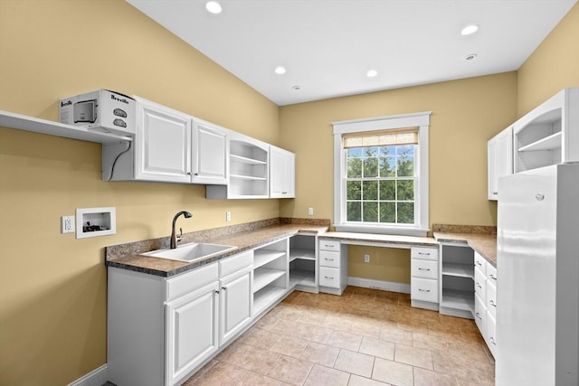 33 Moniz Dr, Westport, MA 02790 - kitchen with open shelves, a sink, freestanding refrigerator, white cabinetry, and recessed lighting