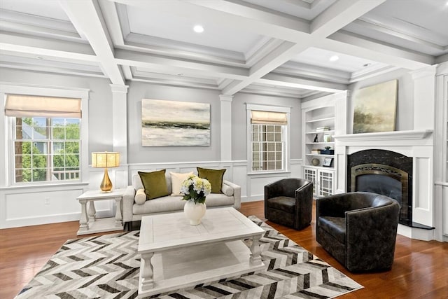 33 Moniz Dr, Westport, MA 02790 - living area featuring wood finished floors, a high end fireplace, coffered ceiling, beam ceiling, and a decorative wall