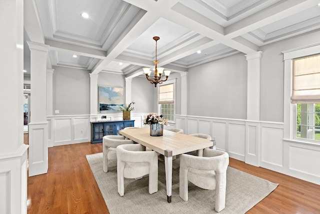33 Moniz Dr, Westport, MA 02790 - dining room featuring decorative columns, plenty of natural light, wood finished floors, beamed ceiling, and a chandelier