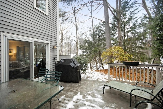 snow covered deck with grilling area