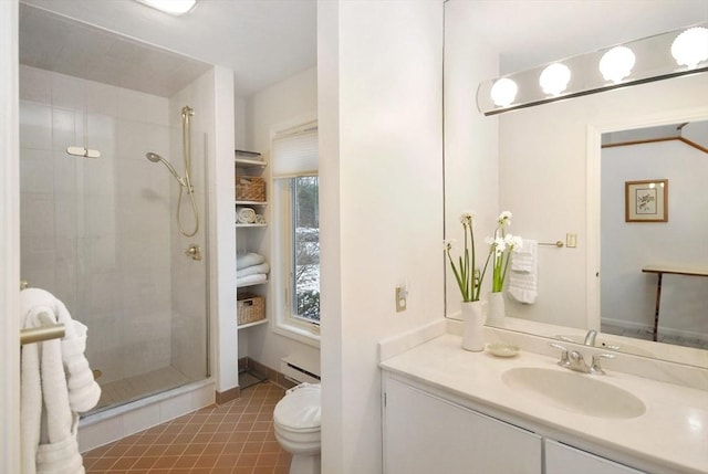 bathroom with tile patterned floors, toilet, a tile shower, a baseboard radiator, and vanity