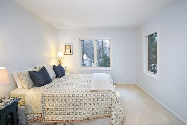 bedroom with light colored carpet