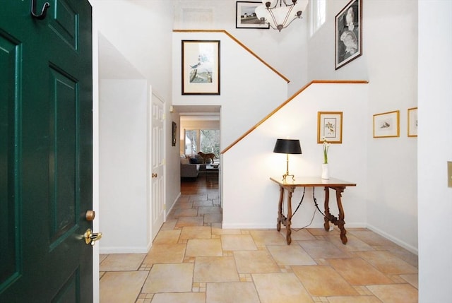 foyer featuring a high ceiling