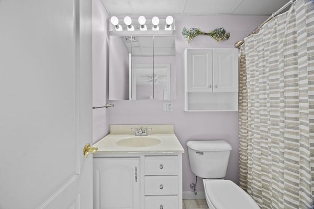 bathroom featuring vanity, toilet, and a shower with curtain