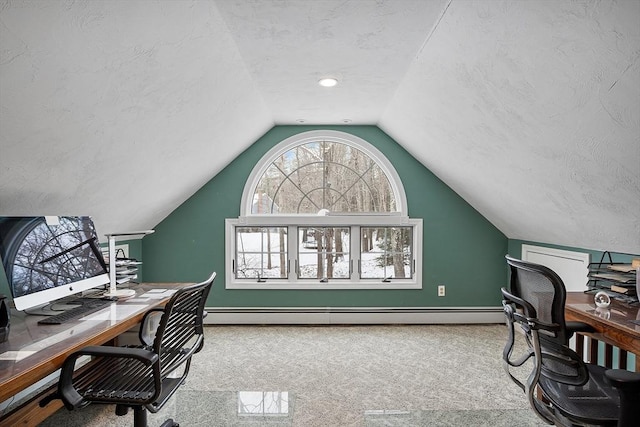 carpeted office with a textured ceiling, baseboard heating, and lofted ceiling