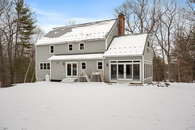 view of snow covered house