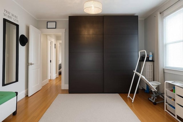 142 Vinal St, Revere, MA 02151 - unfurnished bedroom featuring light wood finished floors and crown molding
