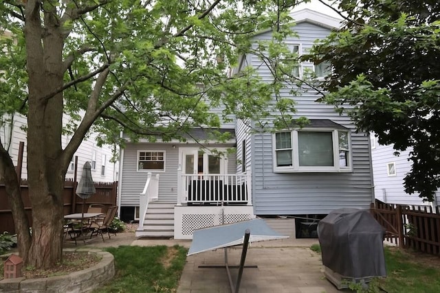 142 Vinal St, Revere, MA 02151 - back of house featuring a fenced backyard, a patio, and a deck