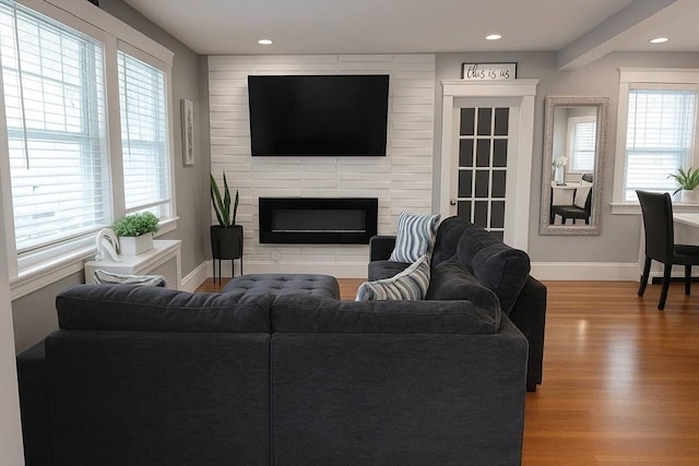 142 Vinal St, Revere, MA 02151 - living area with wood finished floors, healthy amount of natural light, a fireplace, and recessed lighting