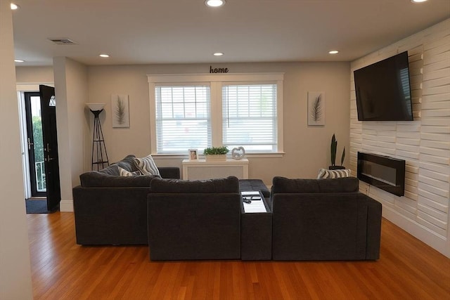 142 Vinal St, Revere, MA 02151 - living area with wood finished floors, a fireplace, and recessed lighting
