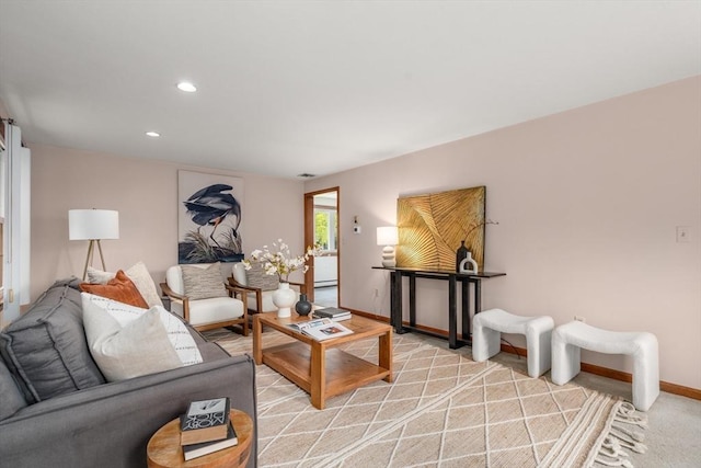 living room with visible vents, recessed lighting, and baseboards