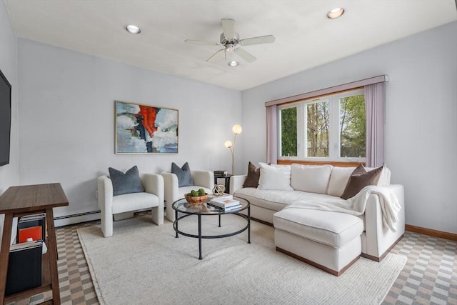 living area with a baseboard heating unit, a ceiling fan, recessed lighting, and baseboards