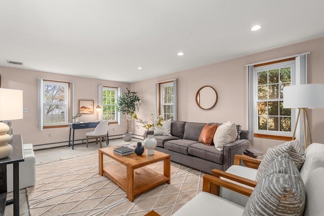 living room featuring visible vents, recessed lighting, baseboards, and a baseboard radiator