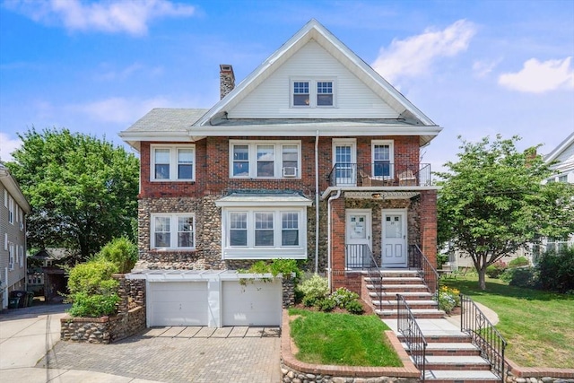 29 Hillcrest Cir Unit 2, Watertown, MA 02472 - view of front of house featuring a chimney, an attached garage, decorative driveway, and brick siding