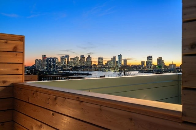 balcony with a view of city and a water view