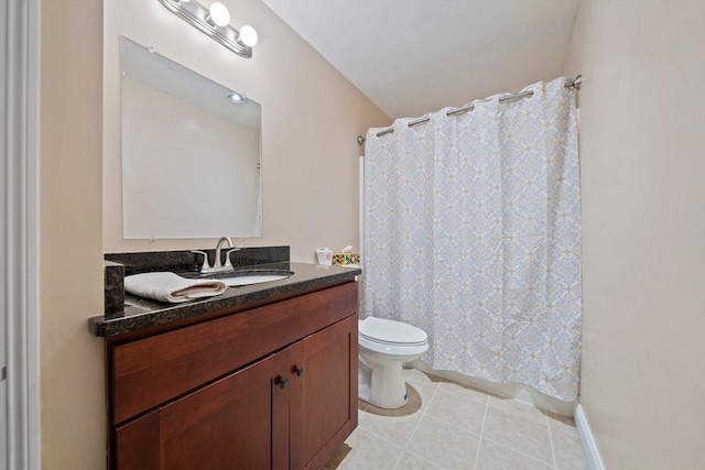 full bathroom with curtained shower, vanity, toilet, and tile patterned floors