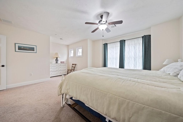 bedroom featuring carpet floors, visible vents, ceiling fan, and baseboards